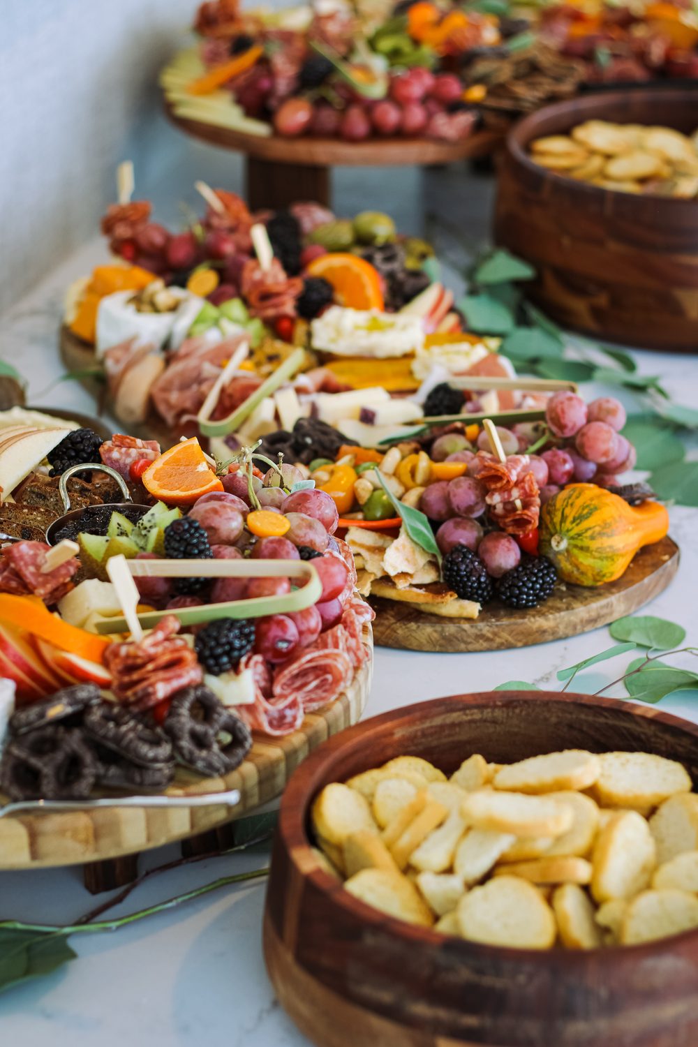 Private chef grazing table with charcuterie boards, fresh fruit and cheeses