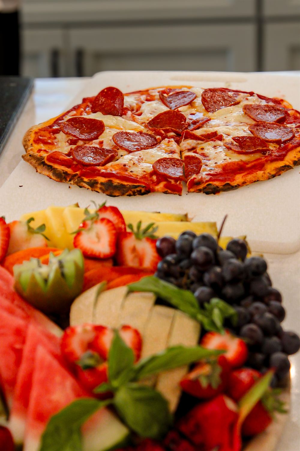 Finished wood-fired pepperoni pizza ready to serve