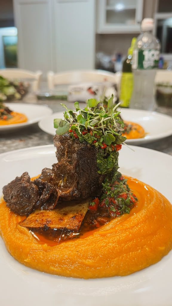 Short rib main course with herb crust on a granite counter