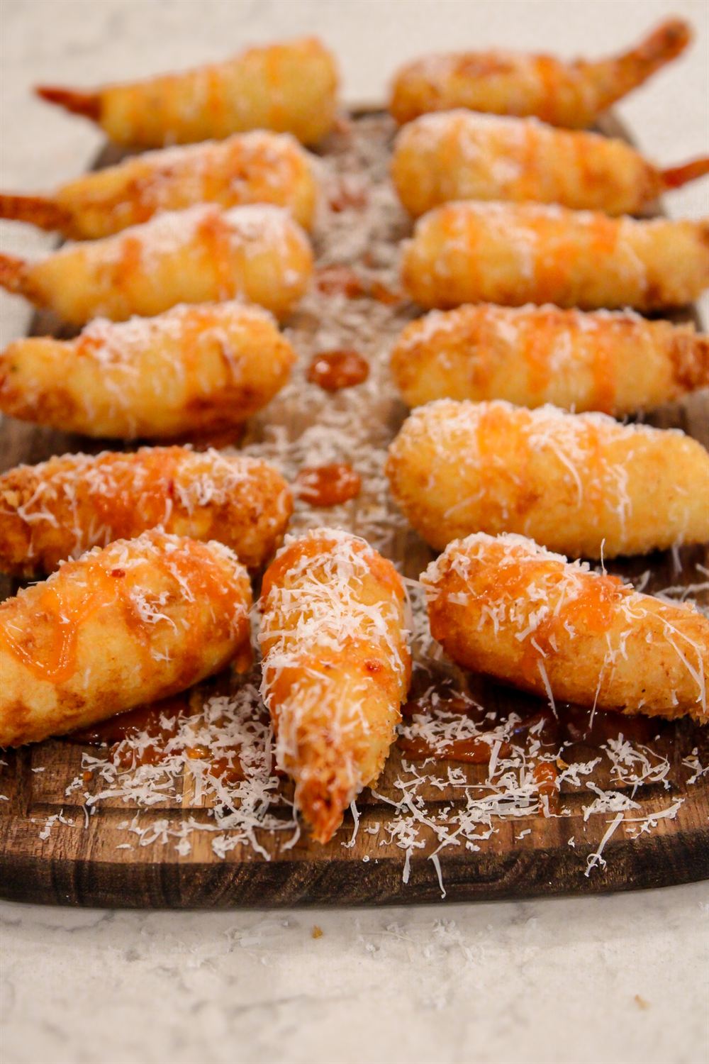Parmesan-crusted shrimp bites plated for a private chef event